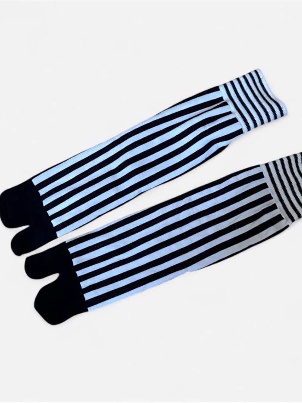 white and black striped warn tabi socks